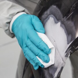 Cleaning a damaged bumper panel