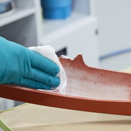 Applying cleaner using a professional panel wipe