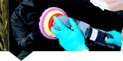 Painter polishing a car panel
