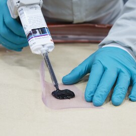 Applying plastic adhesive using a manual gun