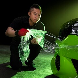 man applying paint protection film