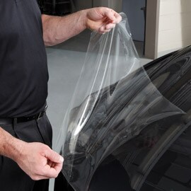 Person applying paint protection film