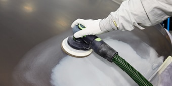 Sanding a car
