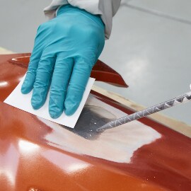 Applying repair materials using a manual gun