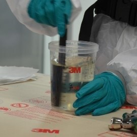 mixing clear coat into a cup