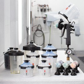 Components of Performance Spray Gun Kit such as nozzles, adaptors, cups, lids, liners, spray gun
