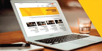 Open laptop showing a homepage of 3M Safety training courses
