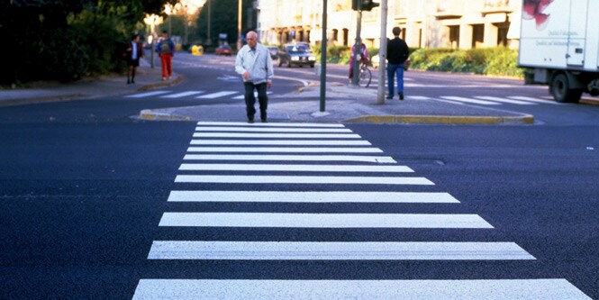 People crossing roads with pedestrian crossings
