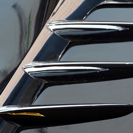 Decorative trim mounted on painted surface