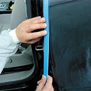 Applying foam masking tape to a car body line
