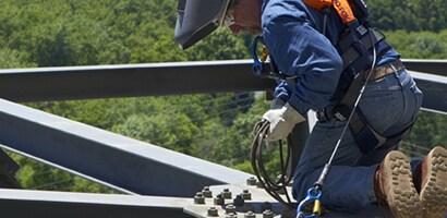 Construction worker in fall protection PPE
