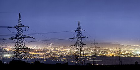 Electric towers in a city landscape
