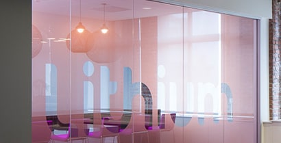 An interior glass wall covered with 3M™ Glass Finishes creates a distinct space with visual
