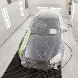 car in a painth booth during forced drying process