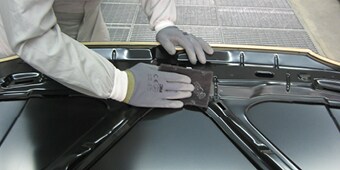 Wiping down a car
