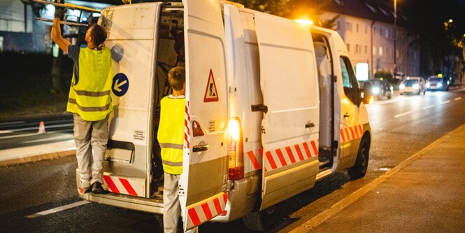 Van parked at side of road with conspicuity markings
