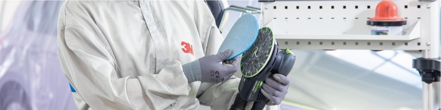 Woman sanding a car
