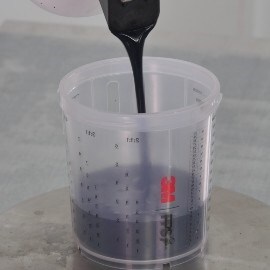 Mixing base coat material into a cup