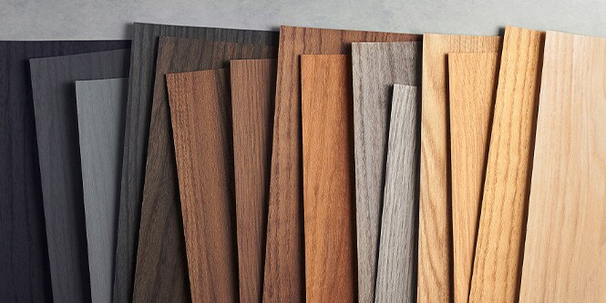 Image of 3M DINOC wood grain samples organized from black to light wood tones.
