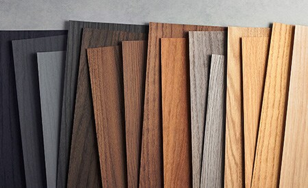 Image of 3M DINOC wood grain samples organized from black to light wood tones.
