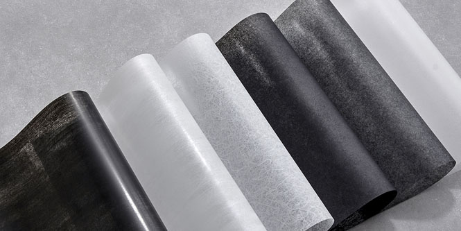 Array of black, white and transparent glass finish samples with various wood grains and patterns.
