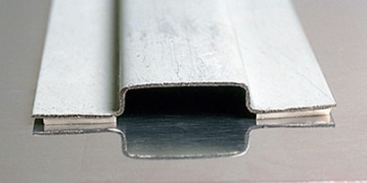 Metal substrates joined together with metal adhesive
