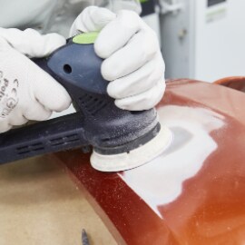 Sanding an area to shape using abrasive disc