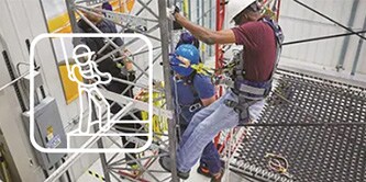 Man working at a height and then a white icon has been placed on top of image
