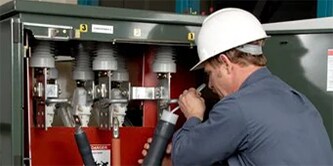A worker is using 3M™ Cold Shrink technology for medium voltage terminations
