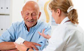physician speaking to a patient
