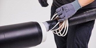 Image showing application of power cables using cold shrink technology
