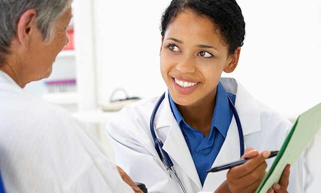 A doctor speaking to a patient
