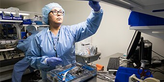 Medical staff in reaching for medical equipment
