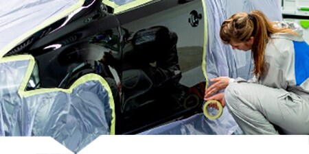 Car being masked as preparation for car body repair
