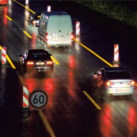 Vehicles following temporary road works signage and markings