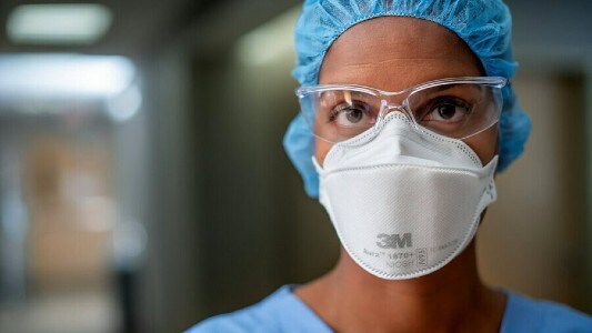 Surgeon wearing personal protective equipment
