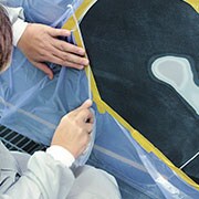 Cutting the masking film around a repair area