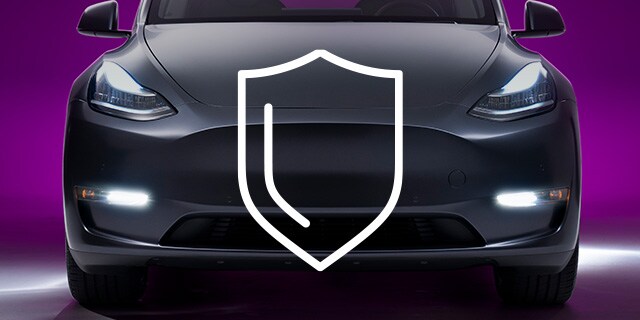 Front bumper of EV car matte gray wrap film and paint protection film with shield icon
