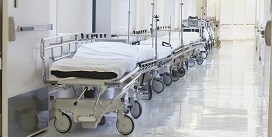 Gurneys in a hospital hallway
