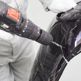 Drilling a hole in a plastic bumper