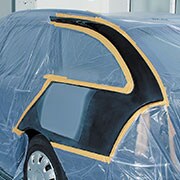 Car part covered with masking films cutted and attached ready for painting